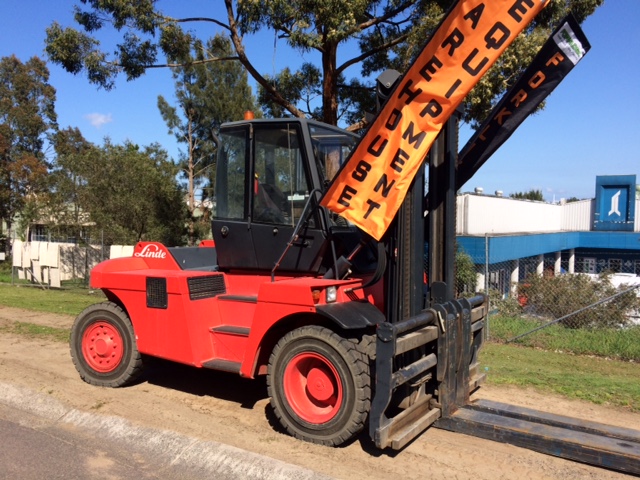 forklift with banner of warehouse equipment sale and hire